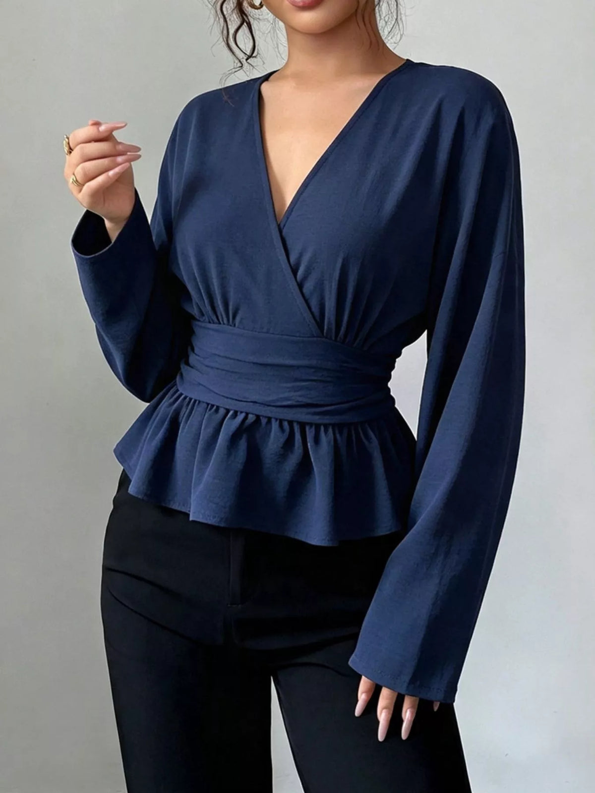 Blus med omlott och peplum