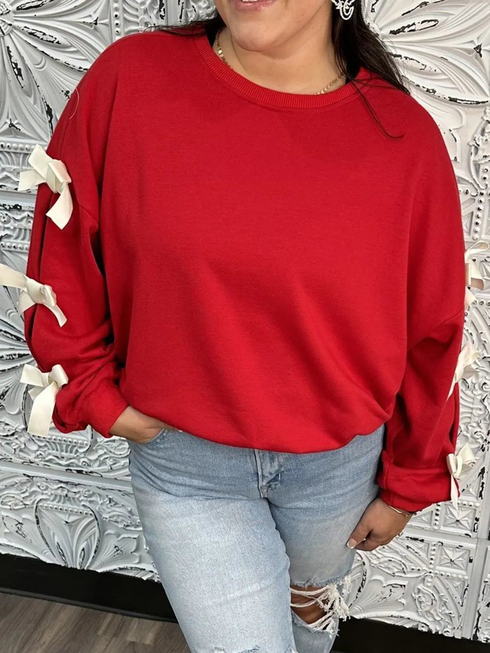 Långärmad sweatshirt med rund halsringning, kontrastsöm och rosett – bild 4