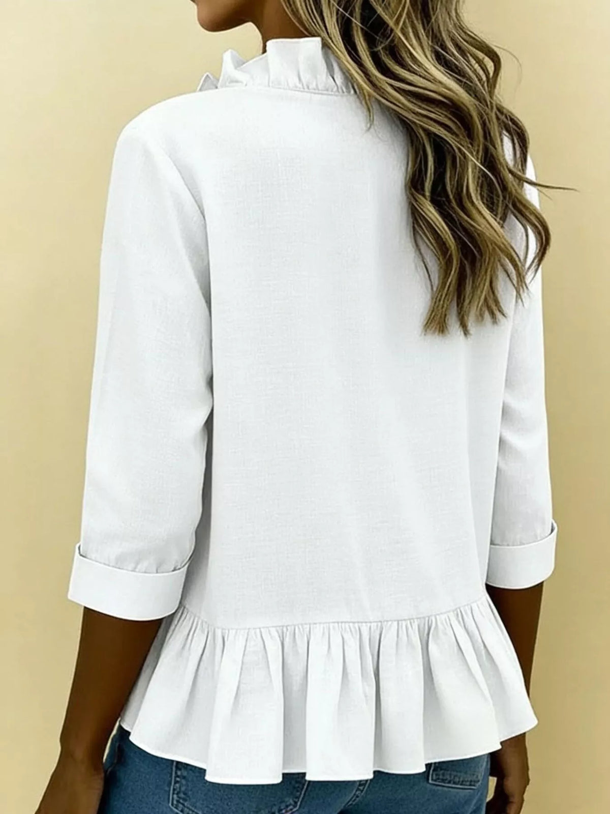 V-ringad blus med peplum – bild 5