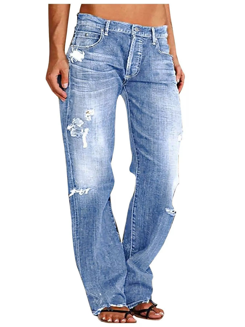 Ledigt sittande jeans med slitna detaljer