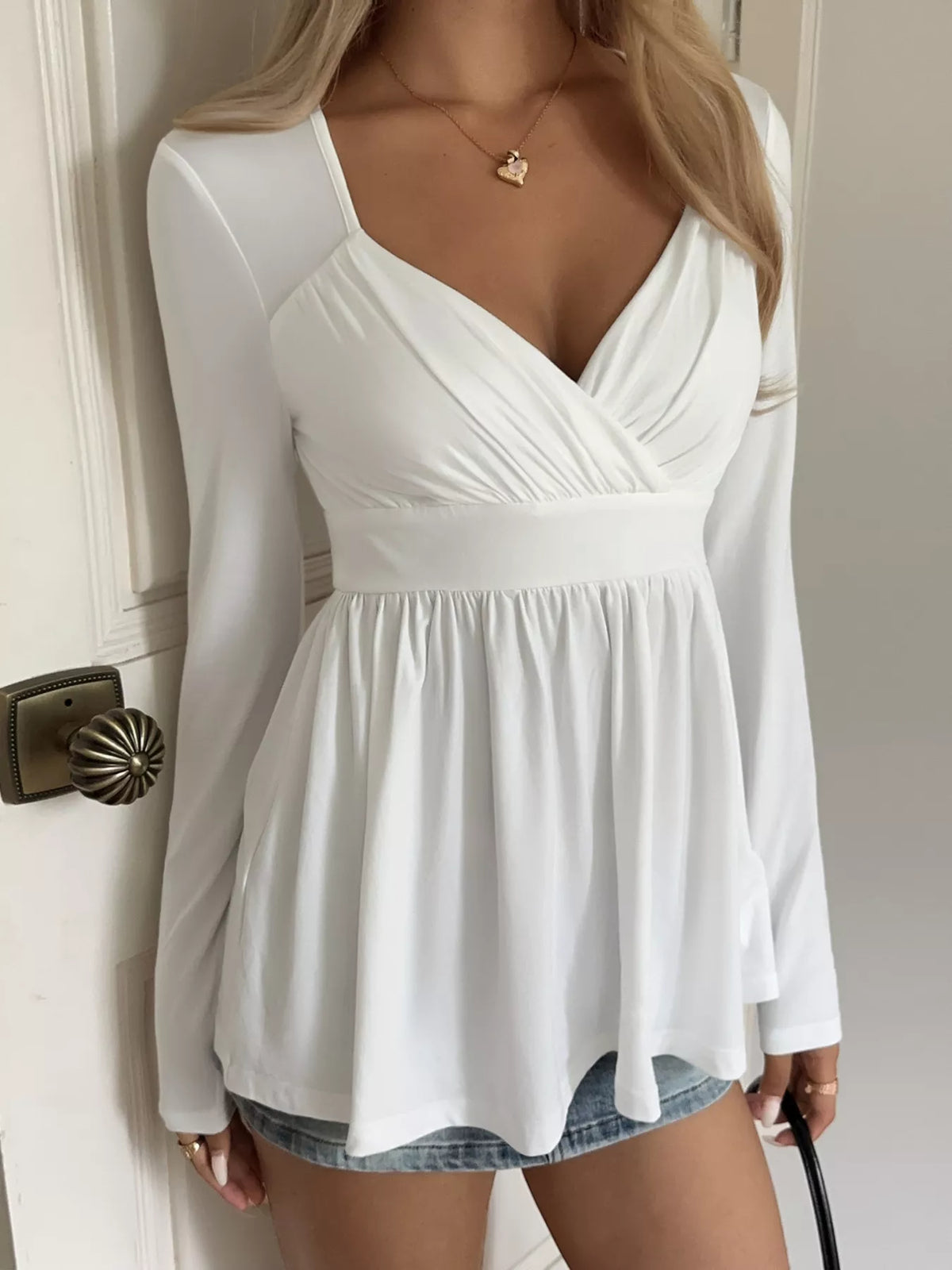 Topp med omlott och peplum – bild 2