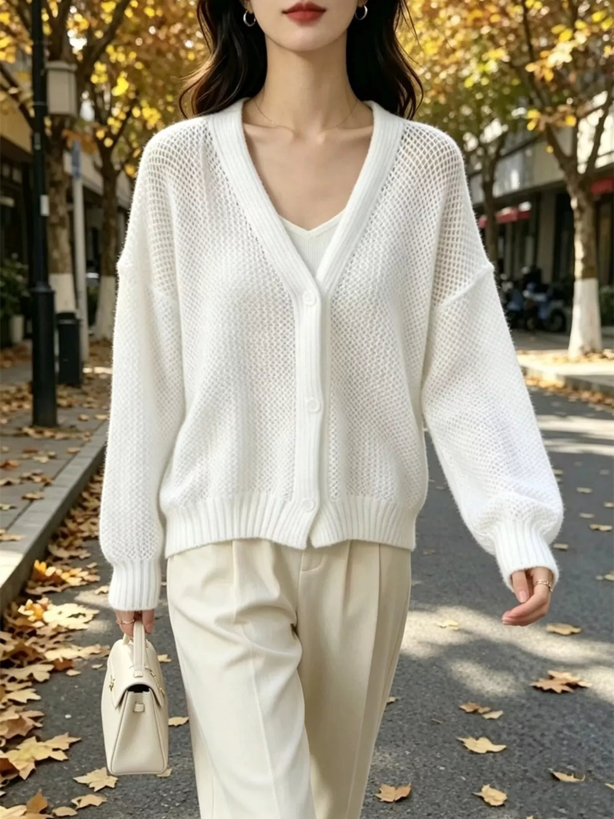 Hålstickad cardigan – bild 3