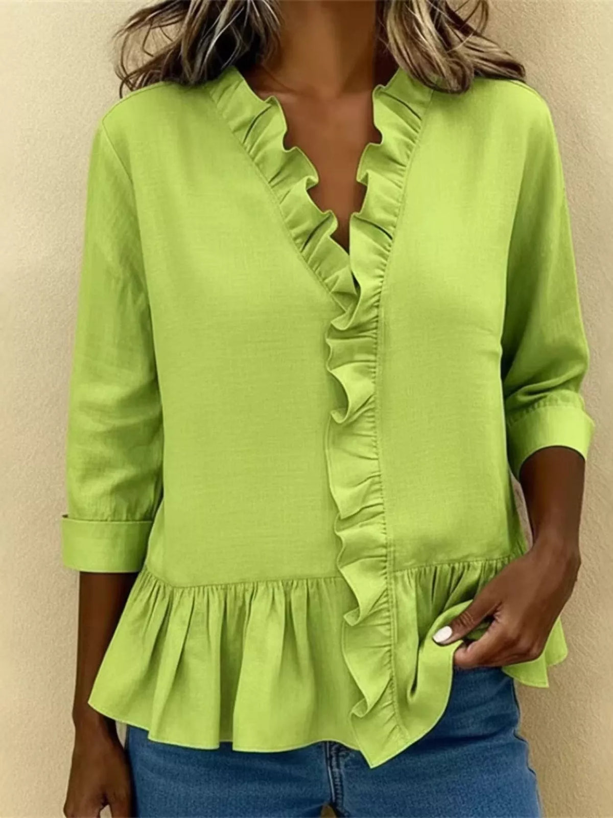 V-ringad blus med peplum – bild 9