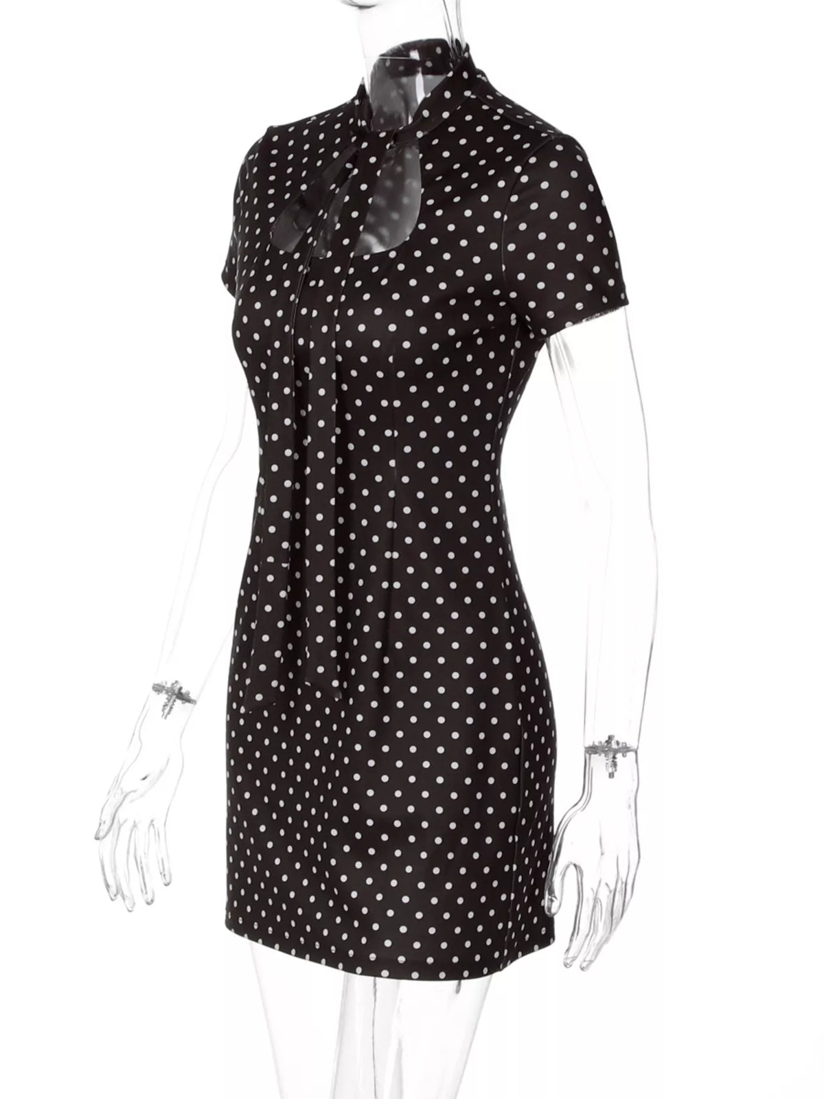 Prickig miniklänning med cut out-detalj – bild 13