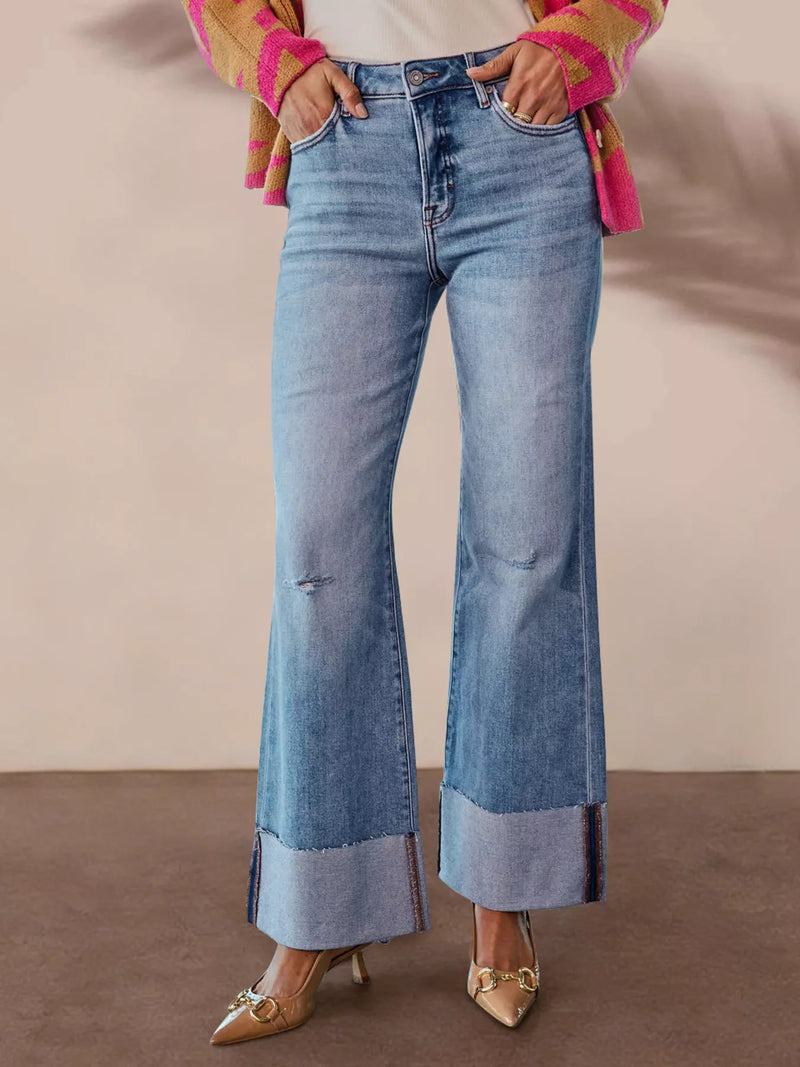 Utsvängda jeans med hög midja och rå kant