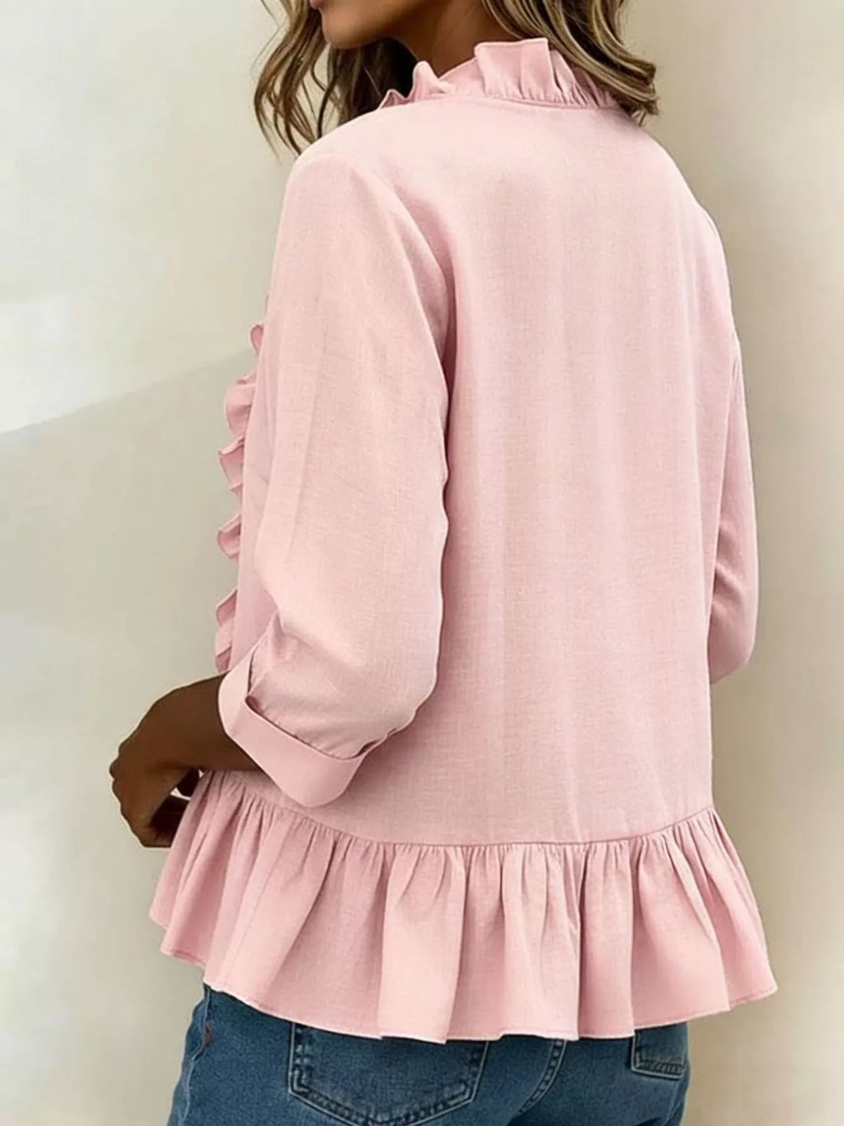 V-ringad blus med peplum – bild 2