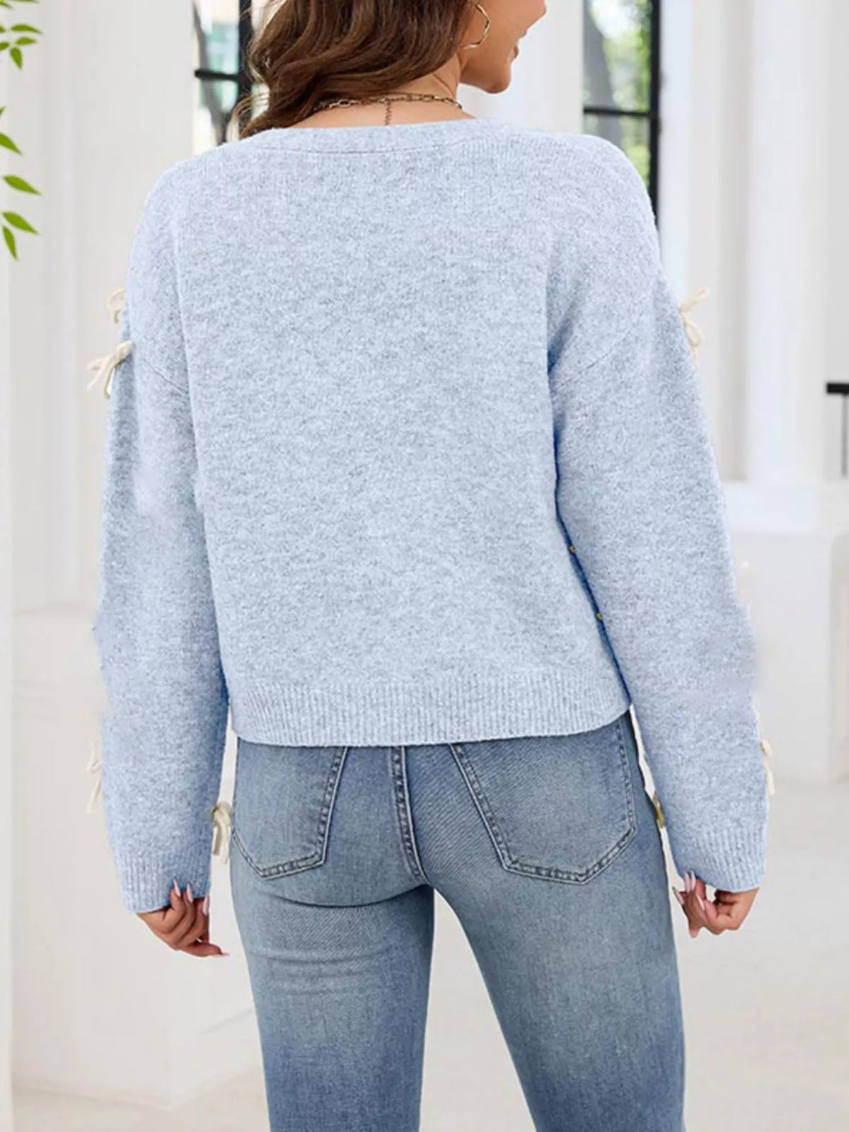 Cardigan med knappstängning och rosett – bild 8