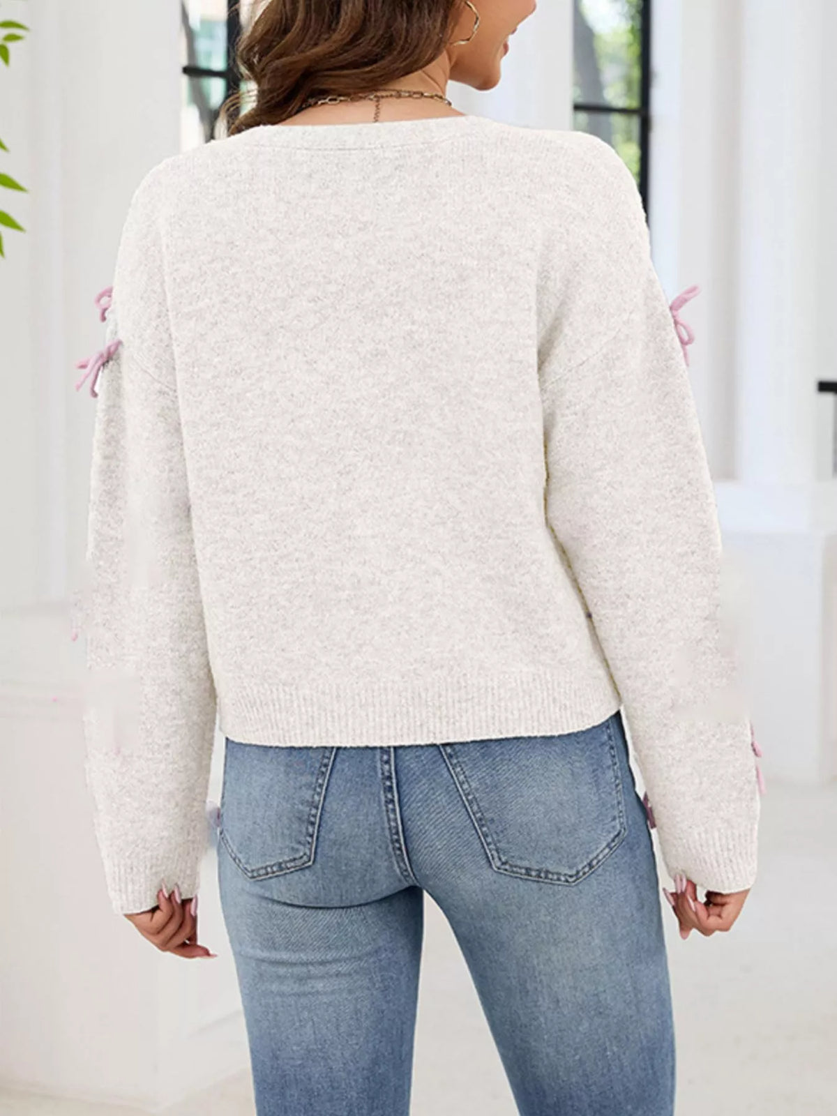 Cardigan med knappstängning och rosett – bild 14