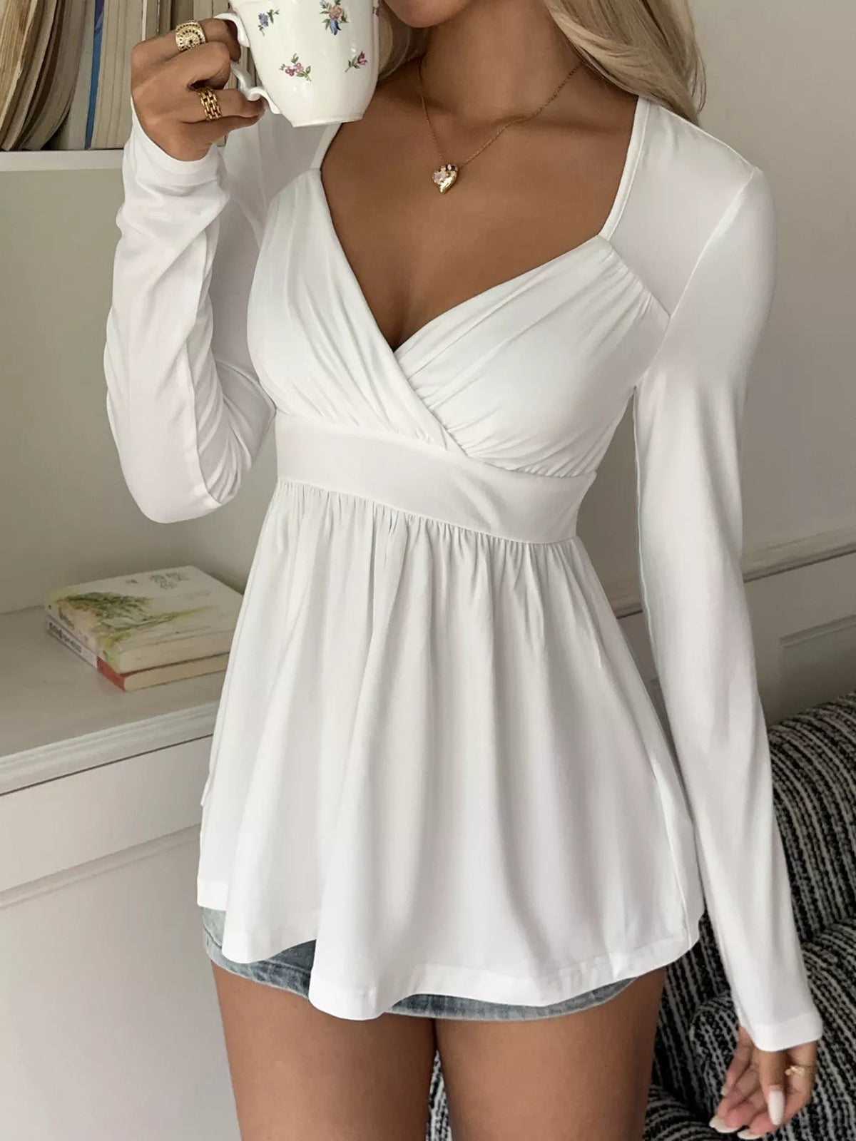 Topp med omlott och peplum – bild 4