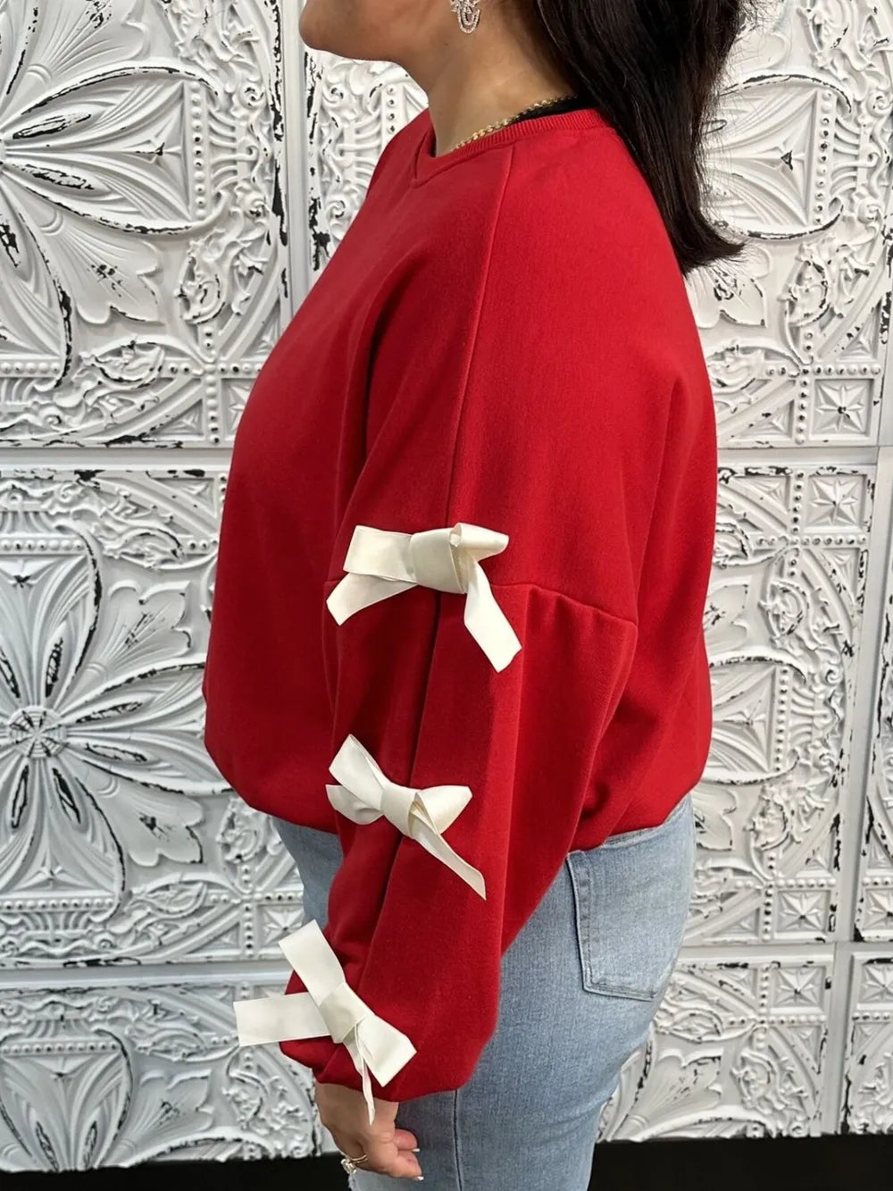 Långärmad sweatshirt med rund halsringning, kontrastsöm och rosett – bild 5