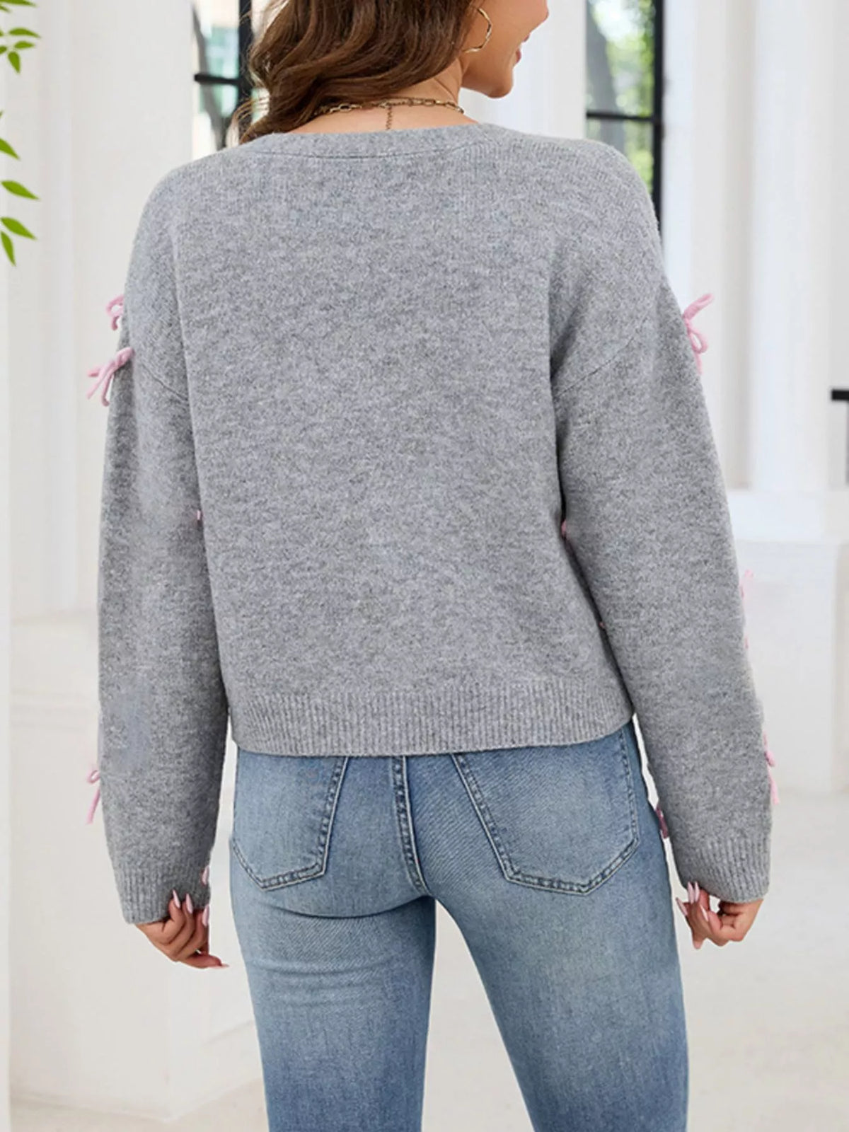 Cardigan med knappstängning och rosett – bild 4