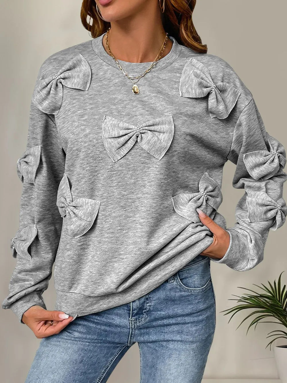 Långärmad sweatshirt med rund halsringning och rosett