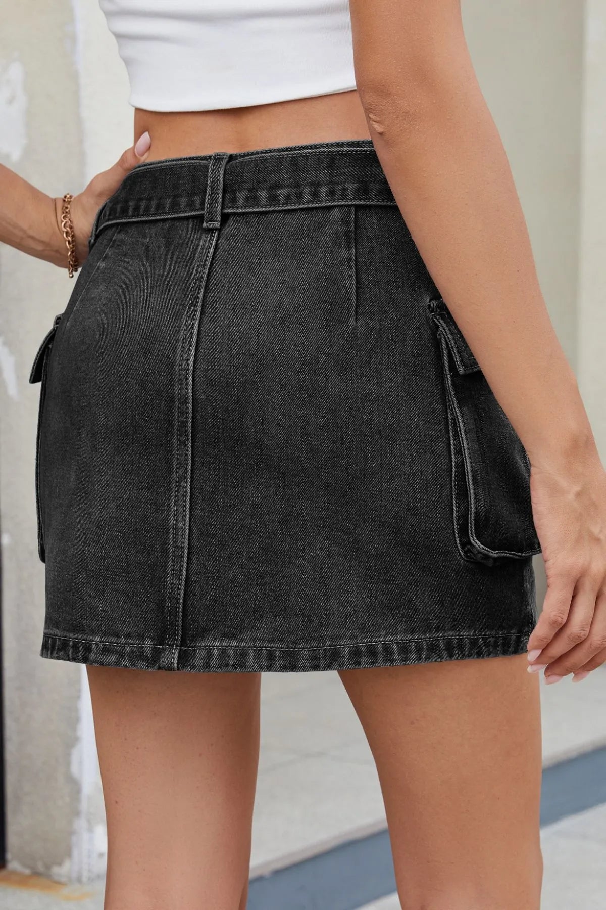 Minikjol i denim med korsad detalj – bild 12