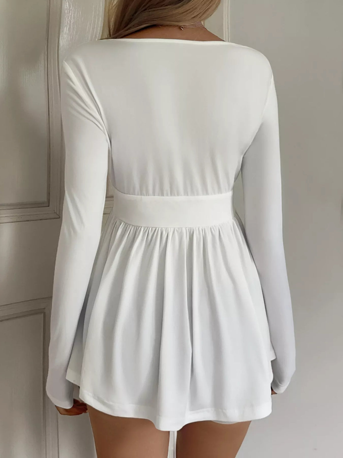 Topp med omlott och peplum – bild 5