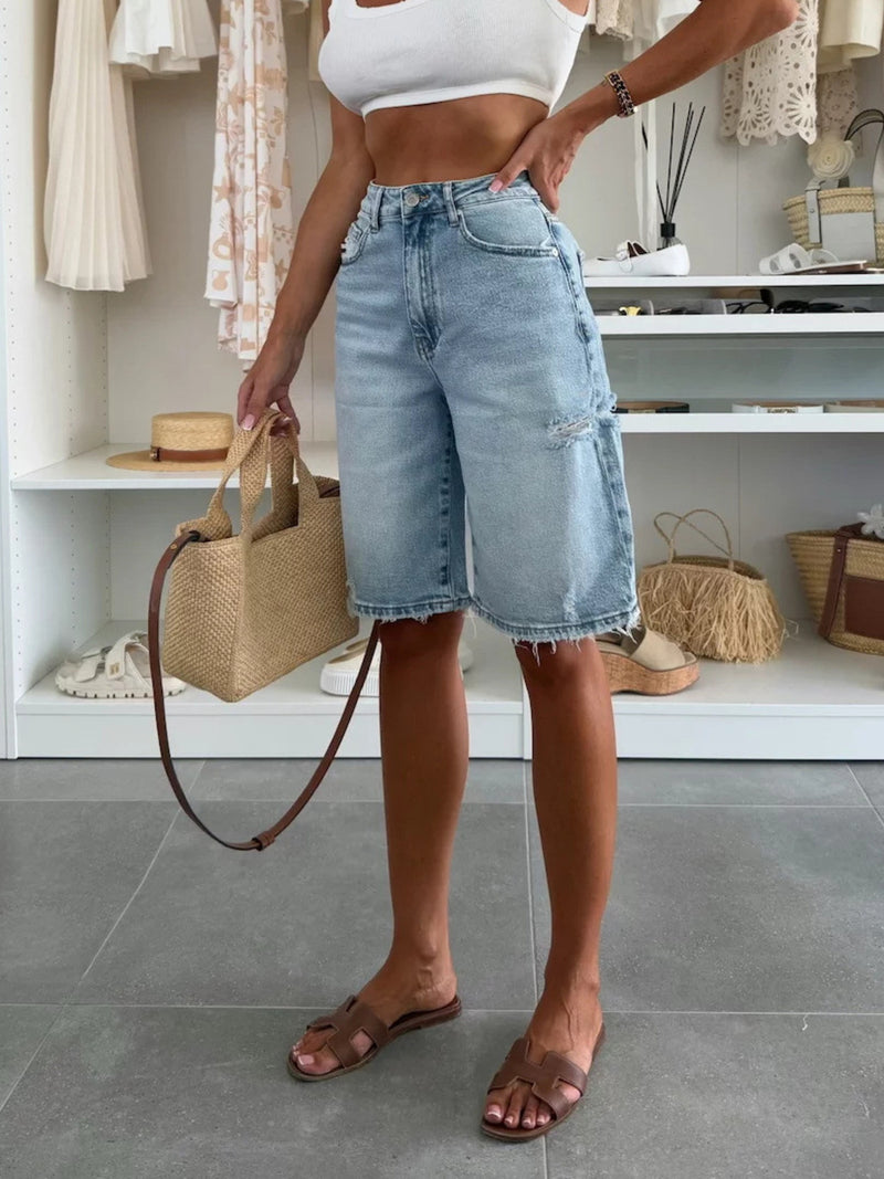 Shorts i denim med hög midja, rå kant och slitna detaljer