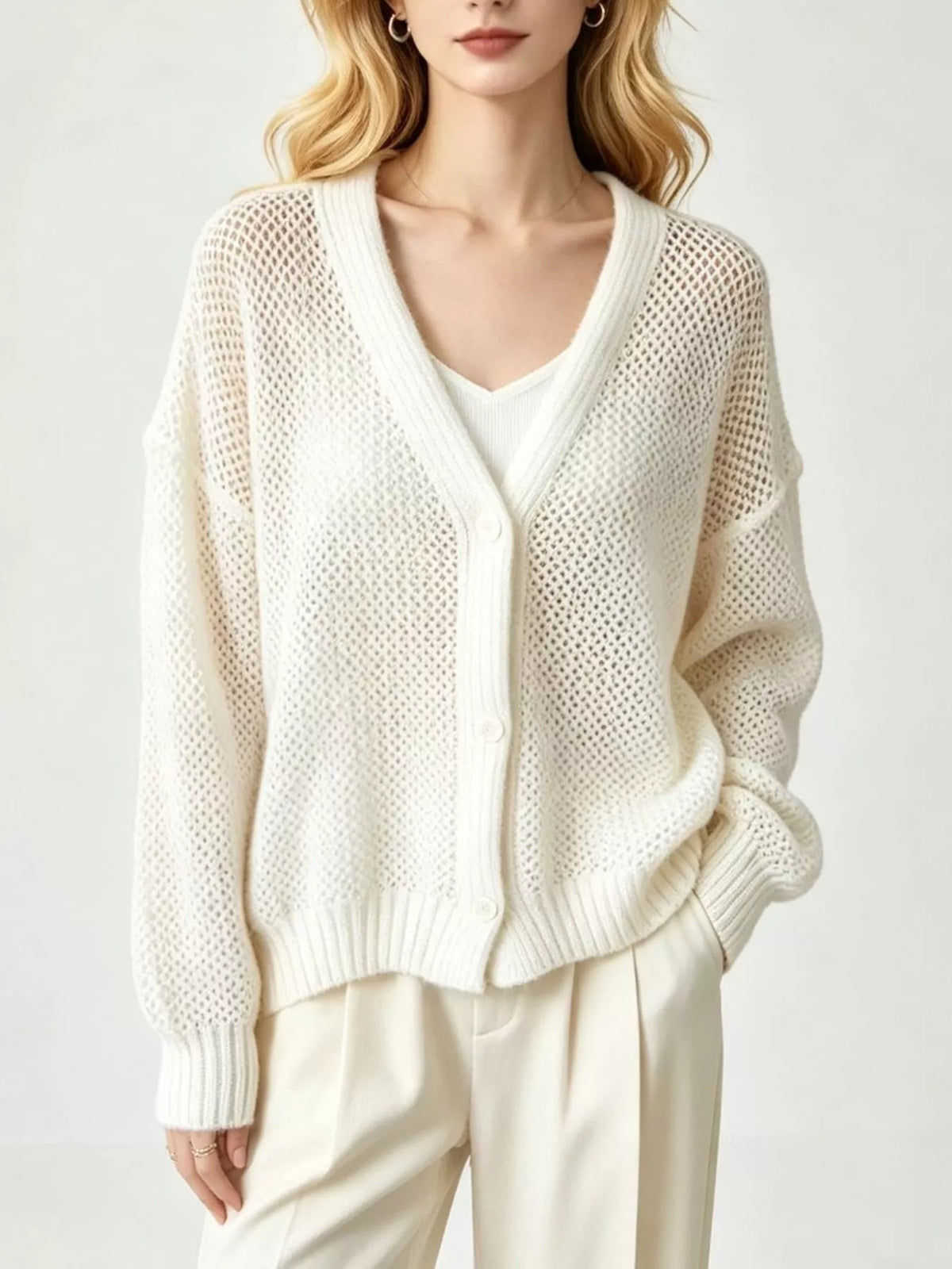 Hålstickad cardigan – bild 2